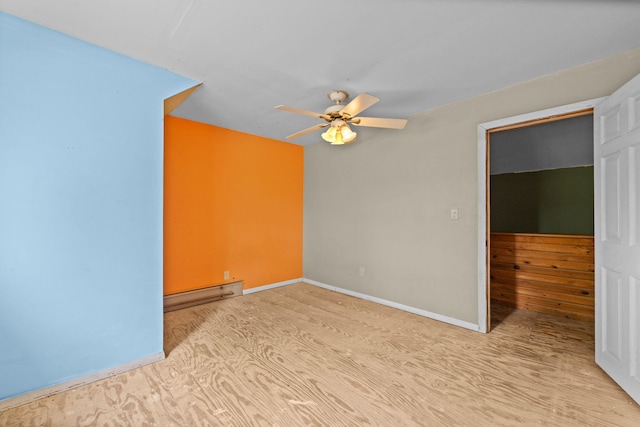 20 Crystal Spring Ln, Rome, ME 04963 - spare room with ceiling fan, baseboard heating, baseboards, and wood finished floors