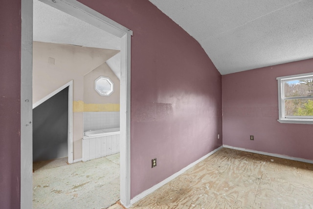 20 Crystal Spring Ln, Rome, ME 04963 - bonus room with lofted ceiling, a textured ceiling, and baseboards