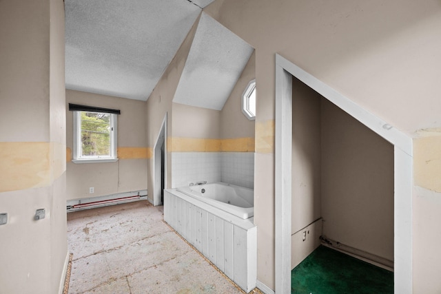 20 Crystal Spring Ln, Rome, ME 04963 - bathroom featuring a baseboard heating unit, a bath, and vaulted ceiling