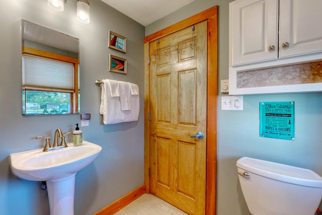 24 Ross Rd, Kennebunk, ME 04043 - bathroom featuring baseboards, toilet, and tile patterned flooring