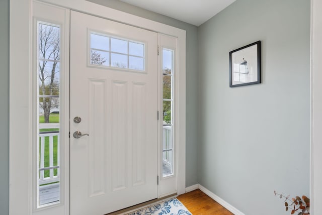 24 Ross Rd, Kennebunk, ME 04043 - foyer entrance featuring plenty of natural light and light wood-style flooring