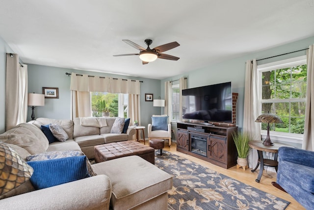 24 Ross Rd, Kennebunk, ME 04043 - living area featuring ceiling fan, wood finished floors, and a glass covered fireplace