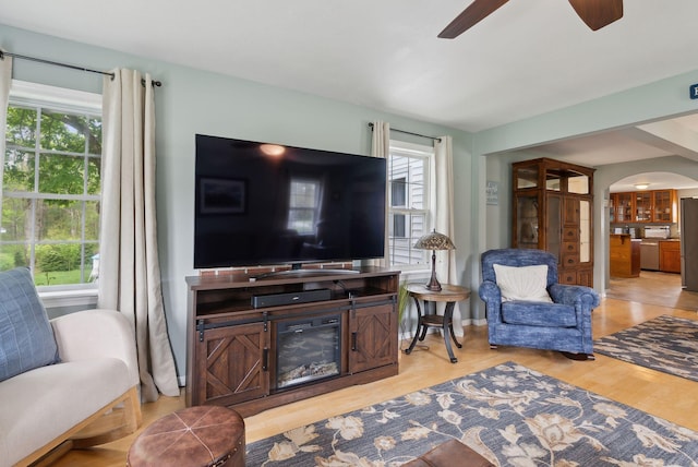 24 Ross Rd, Kennebunk, ME 04043 - living area with a ceiling fan, arched walkways, plenty of natural light, and wood finished floors