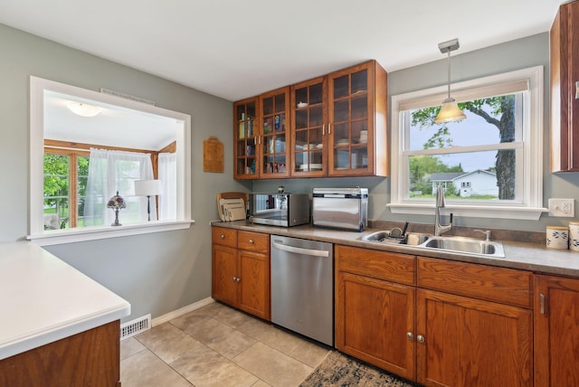 24 Ross Rd, Kennebunk, ME 04043 - kitchen with appliances with stainless steel finishes, a sink, brown cabinets, and healthy amount of natural light