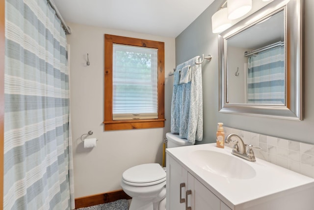 24 Ross Rd, Kennebunk, ME 04043 - bathroom featuring toilet, vanity, curtained shower, and baseboards