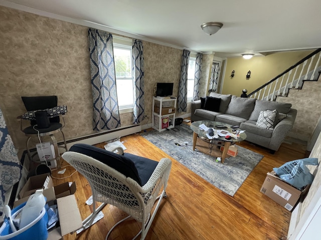 living room featuring wood finished floors and stairs