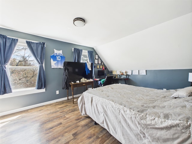 60 Carson Rd, Perham, ME 04766 - bedroom with lofted ceiling, baseboards, and wood finished floors