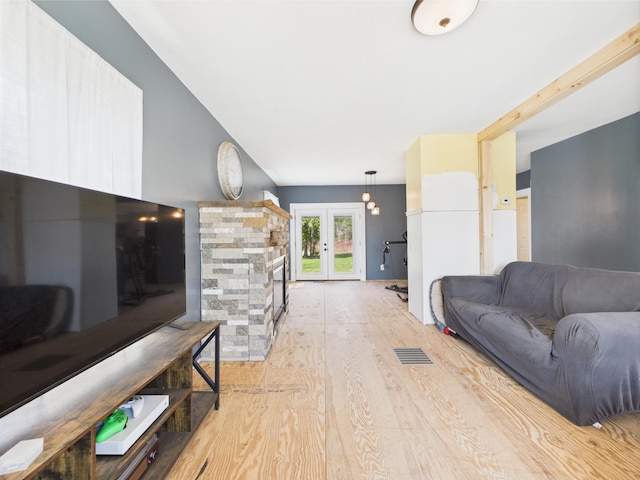 60 Carson Rd, Perham, ME 04766 - living room featuring french doors, visible vents, and wood finished floors