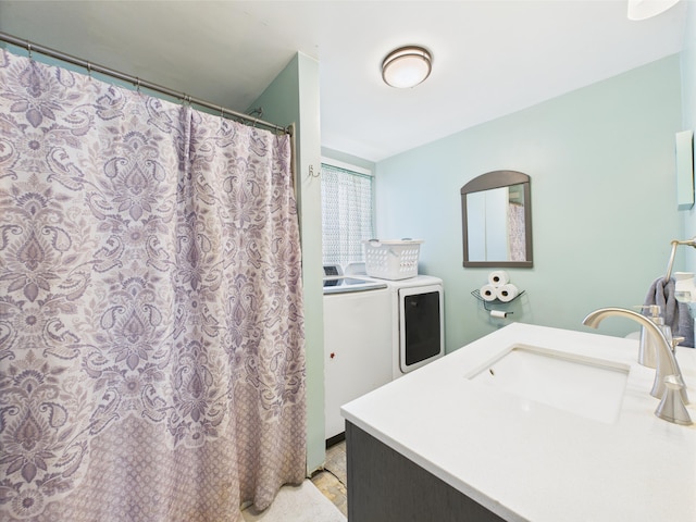 60 Carson Rd, Perham, ME 04766 - bathroom with washing machine and clothes dryer and vanity