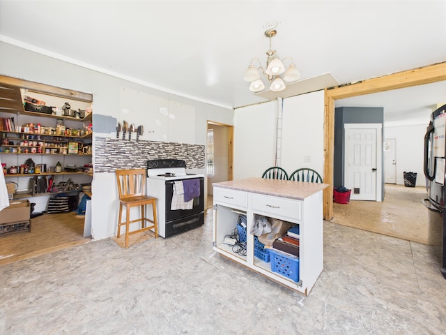 60 Carson Rd, Perham, ME 04766 - kitchen featuring freestanding refrigerator, decorative light fixtures, a chandelier, a center island, and electric stove