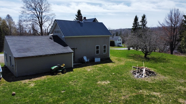 60 Carson Rd, Perham, ME 04766 - exterior space featuring metal roof, a chimney, and a lawn