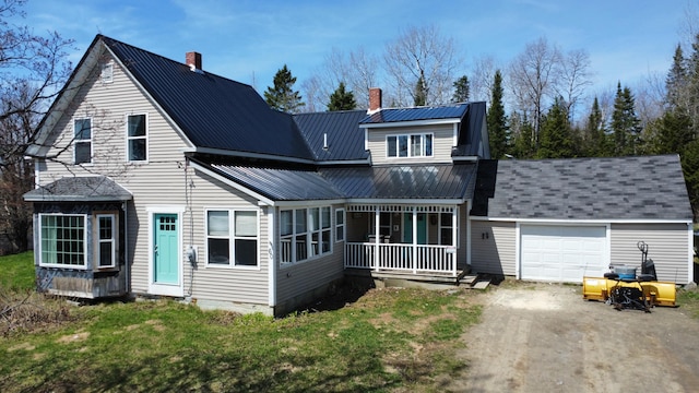 60 Carson Rd, Perham, ME 04766 - view of front of house with an attached garage, dirt driveway, covered porch, and a chimney