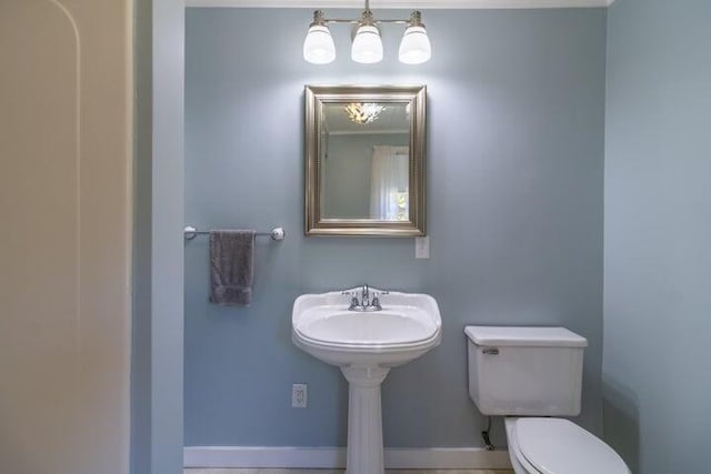 753 Sebec Village Rd, Sebec, ME 04481 - bathroom with toilet and baseboards