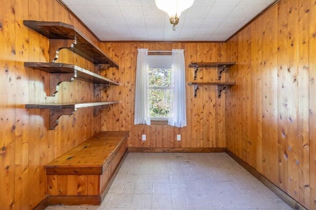 753 Sebec Village Rd, Sebec, ME 04481 - mudroom featuring wood walls, baseboards, and light floors