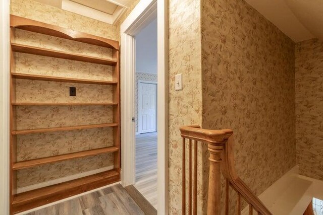753 Sebec Village Rd, Sebec, ME 04481 - stairs featuring wood finished floors and wallpapered walls