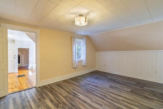 753 Sebec Village Rd, Sebec, ME 04481 - additional living space with wood finished floors, baseboards, and lofted ceiling