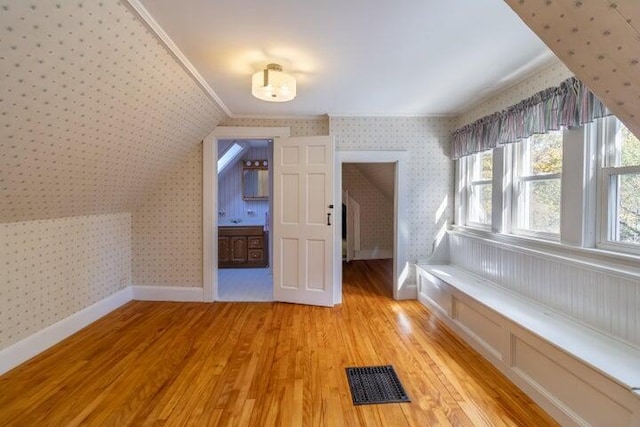 753 Sebec Village Rd, Sebec, ME 04481 - bonus room with wallpapered walls, light wood-type flooring, and baseboards