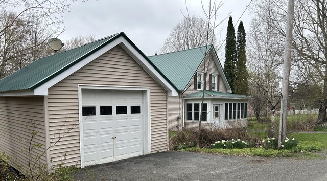 753 Sebec Village Rd, Sebec, ME 04481 - detached garage featuring driveway