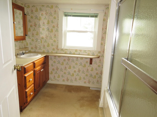 full bath featuring vanity, baseboards, and wallpapered walls