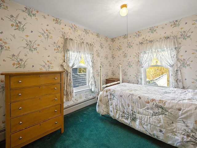 carpeted bedroom with baseboard heating, multiple windows, and wallpapered walls