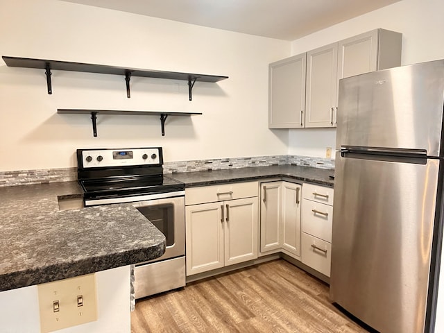 1 Saco Island Ter Unit 205, Saco, ME 04072 - kitchen with appliances with stainless steel finishes, open shelves, and light wood finished floors
