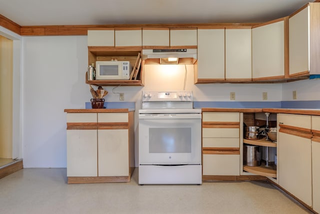 kitchen featuring under cabinet range hood, cream cabinetry, white appliances, and light countertops