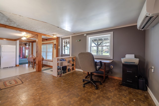 home office featuring baseboards and an AC wall unit