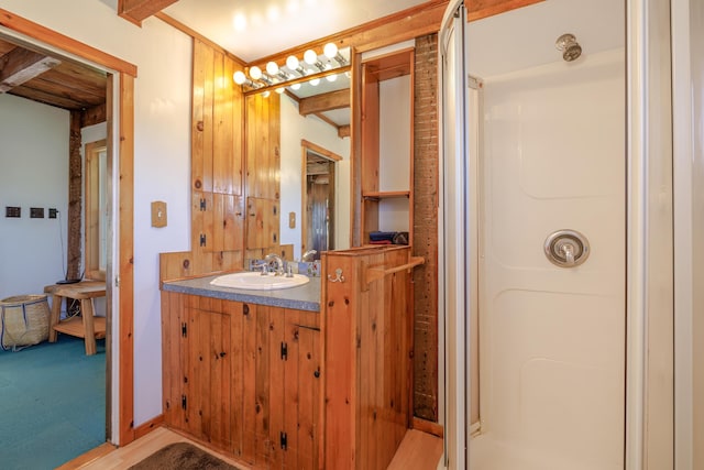 bathroom with a stall shower and vanity