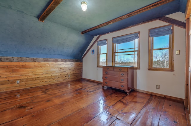 bonus room featuring baseboards, hardwood / wood-style floors, plenty of natural light, and vaulted ceiling with beams
