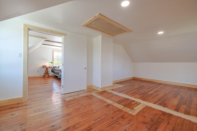 bonus room with lofted ceiling, baseboards, light wood-style flooring, and recessed lighting