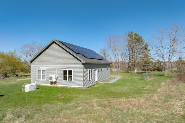 370 Christian Ridge Rd, Ellsworth, ME 04605 - rear view of house with a yard and solar panels