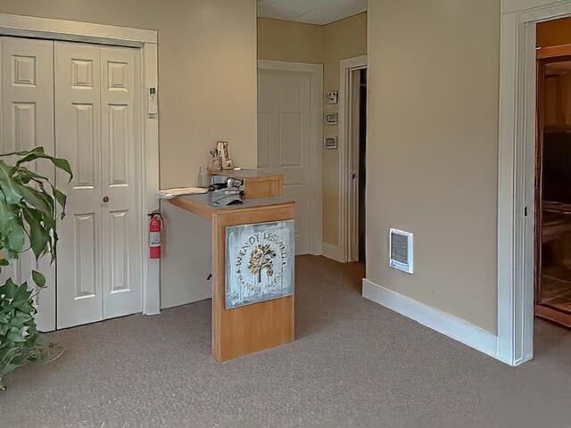 interior space featuring baseboards and visible vents