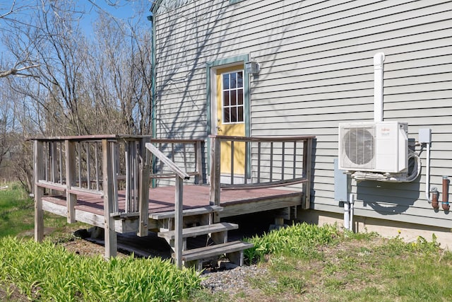 wooden terrace featuring ac unit