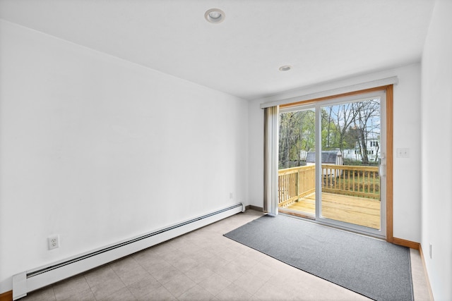spare room featuring a baseboard radiator, baseboards, and recessed lighting