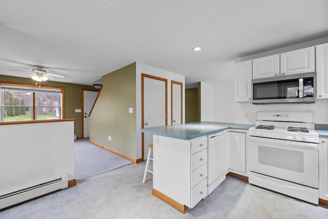 kitchen featuring white appliances, a baseboard heating unit, a peninsula, white cabinets, and ceiling fan