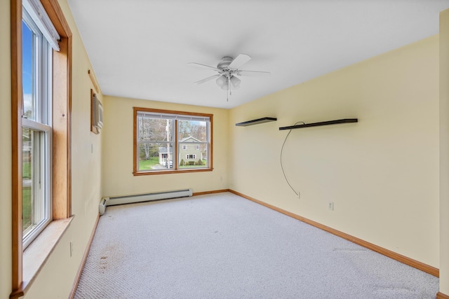 spare room featuring a baseboard radiator, light carpet, ceiling fan, and baseboards
