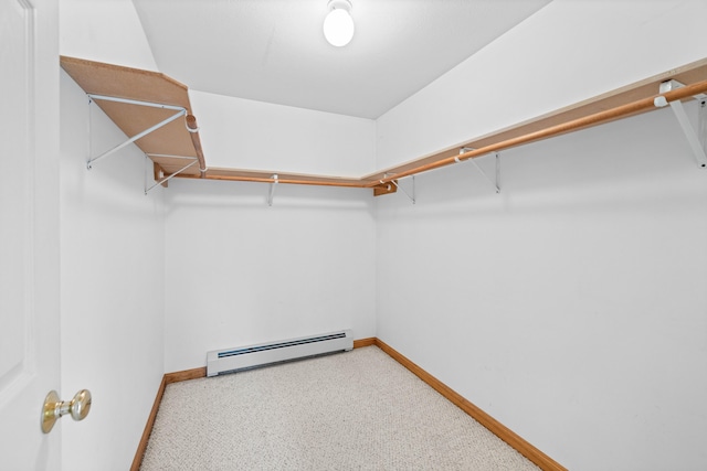 walk in closet with a baseboard heating unit