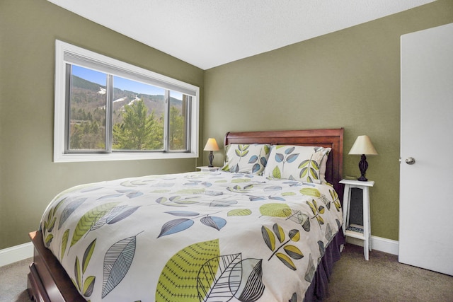 bedroom featuring carpet flooring and baseboards