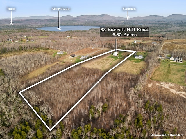 83 Barrett Hill Rd, Hope, ME 04847 - aerial view of property and surrounding area with property boundaries highlighted and a water and mountain view