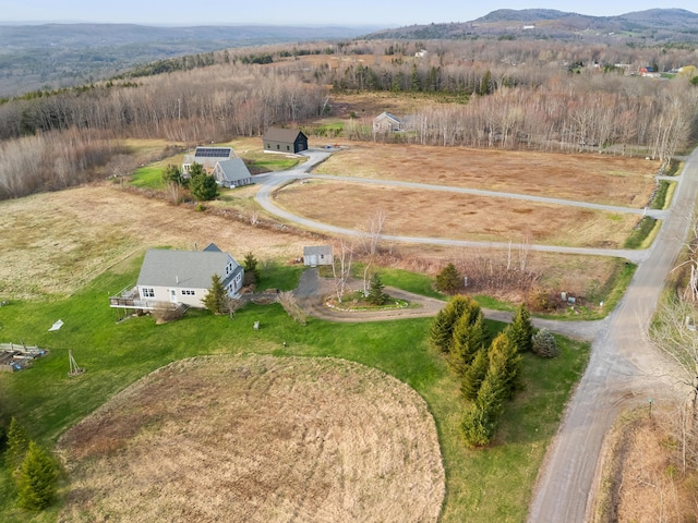 83 Barrett Hill Rd, Hope, ME 04847 - aerial overview of property's location with a mountain backdrop and rural landscape