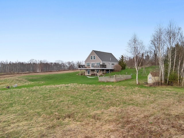 83 Barrett Hill Rd, Hope, ME 04847 - view of green lawn featuring a wooden deck, an outdoor structure, and a storage unit