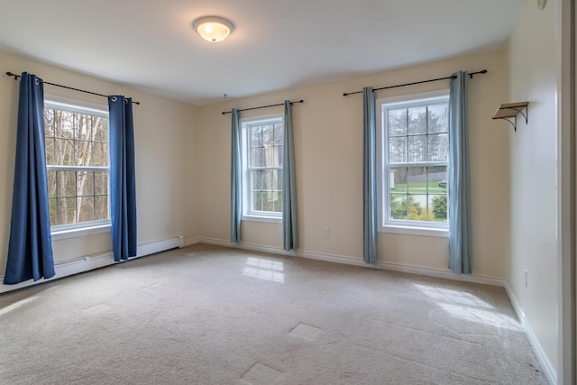 carpeted spare room with baseboards
