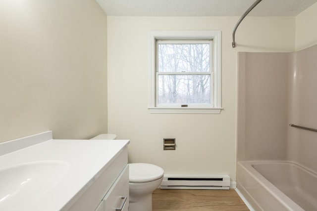3 Great Pond Ter Unit 3, Cape Elizabeth, ME 04107 - full bath featuring toilet, wood finished floors, a textured ceiling, baseboard heating, and vanity