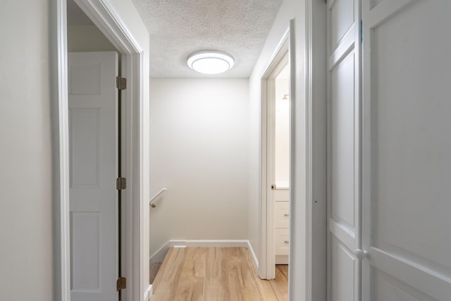 3 Great Pond Ter Unit 3, Cape Elizabeth, ME 04107 - hallway featuring light wood finished floors, a textured ceiling, and baseboards