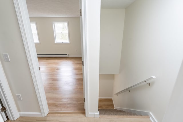3 Great Pond Ter Unit 3, Cape Elizabeth, ME 04107 - staircase featuring wood finished floors, baseboards, and a baseboard heating unit