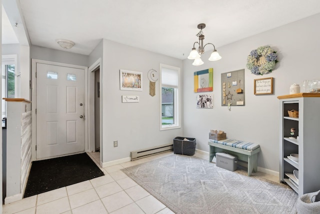 entryway with a baseboard heating unit, healthy amount of natural light, a chandelier, and baseboards
