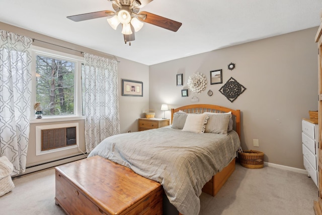bedroom featuring light carpet, a baseboard radiator, a wall mounted AC, a ceiling fan, and baseboards