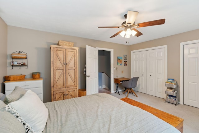 bedroom with a ceiling fan and light colored carpet