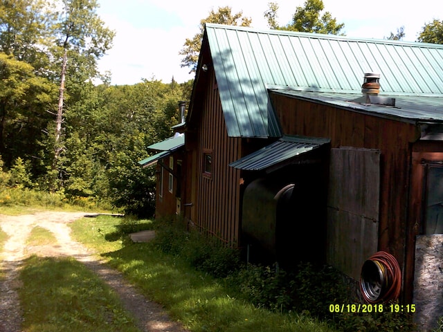 17 Kingsbury Rd, Wellington, ME 04942 - view of side of property with metal roof