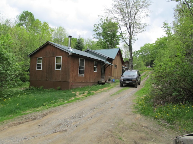 17 Kingsbury Rd, Wellington, ME 04942 - view of property exterior featuring driveway and metal roof